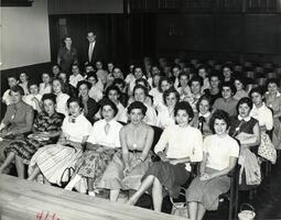 Students at assembly in auditorium.