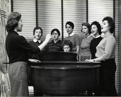 Students at piano singing