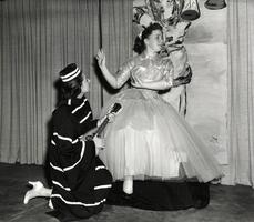 Two students on stage in costume