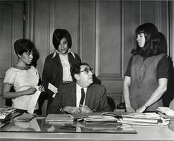 Three students speaking with Dean David Mirsky