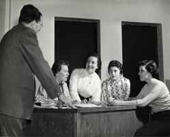 Students with professor in science class