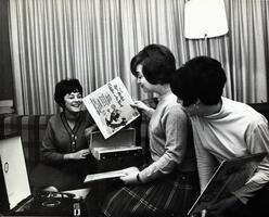Students with record player listening to music