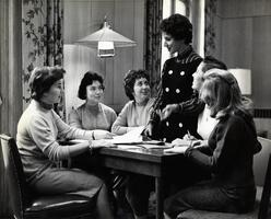 Students working together at table in lounge