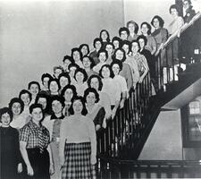 Sophomores of Class of 1961 posing on stairs