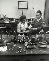 Attendee at Open House in chemistry lab with instructor