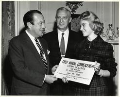 Student presenting oversized ticket to first SCW commencement to New York City Mayor Robert Wagner.  Max Stern also pictured.