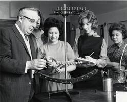 Professor of Physics Henry Lisman demonstrating concepts to students