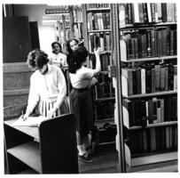 Students in library stacks