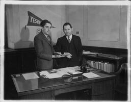 Dean of Yeshiva College Shelley Saphire and unknown man in office